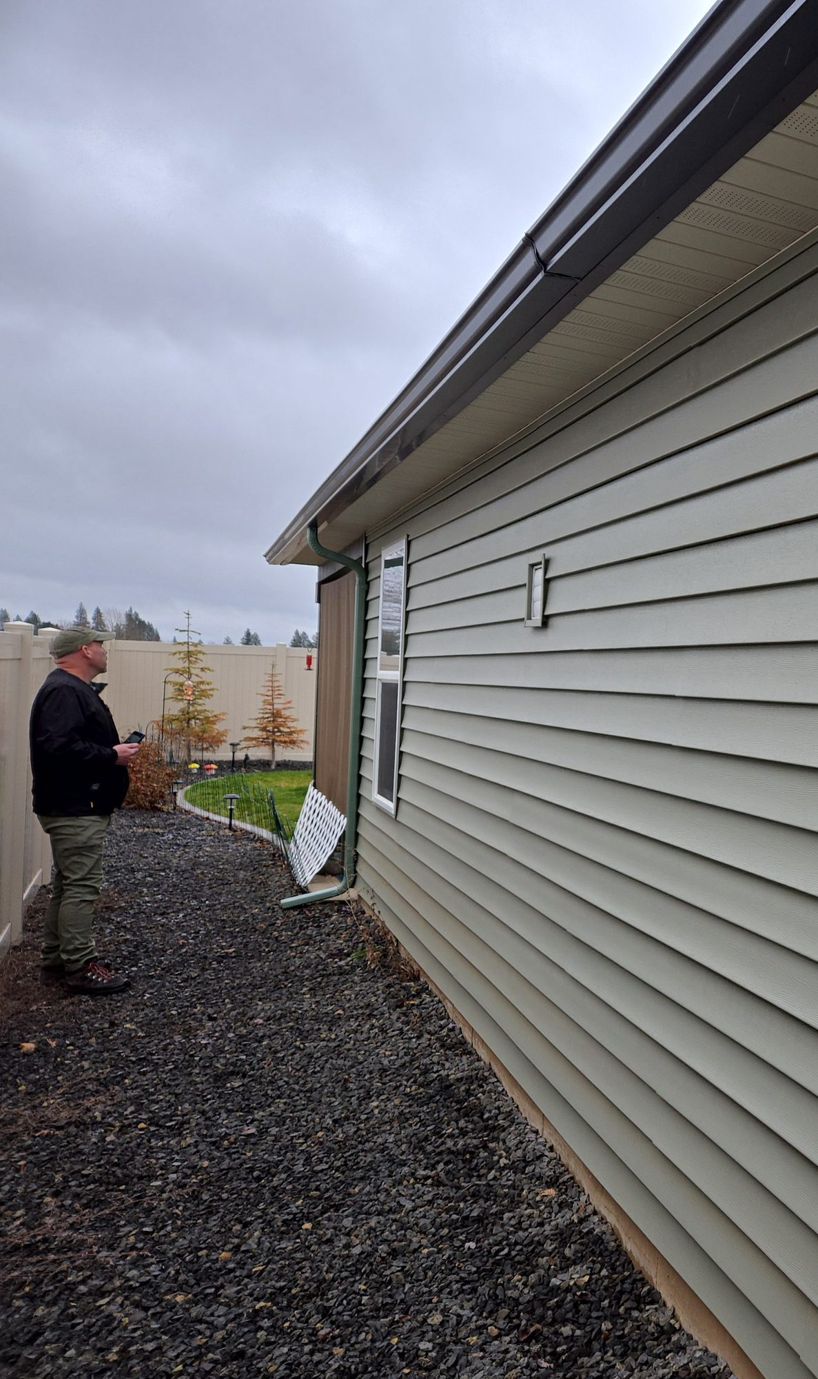 Inspector examining the exterior of a home